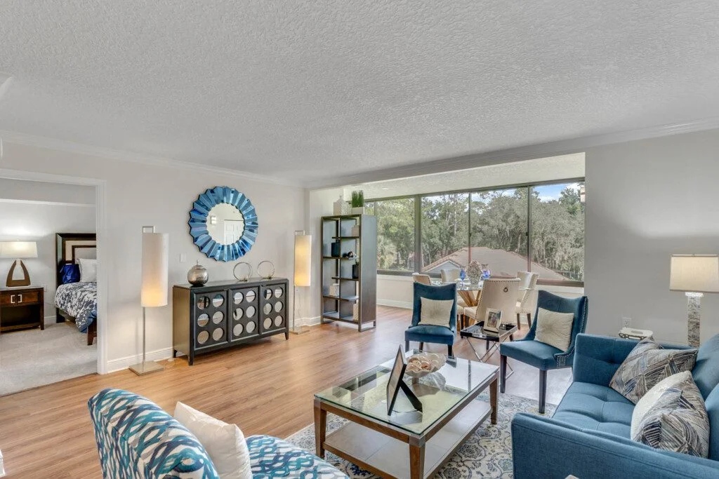 fully furnished, expansive living room and dining area of senior villa at Village on the Green