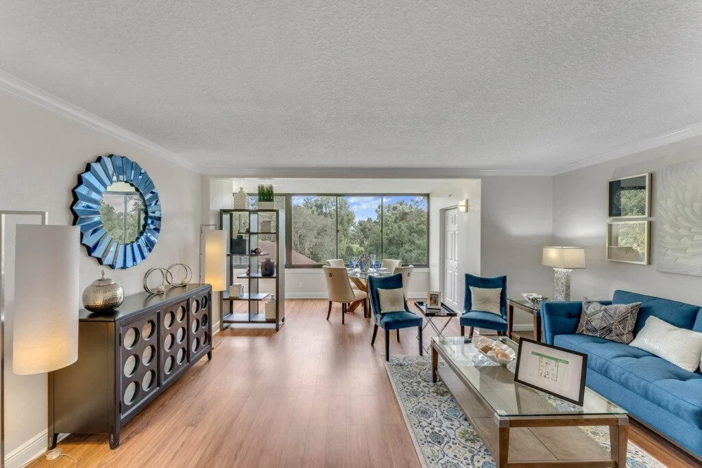 expansive dining and living area of senior villa home featuring wall-to-wall window