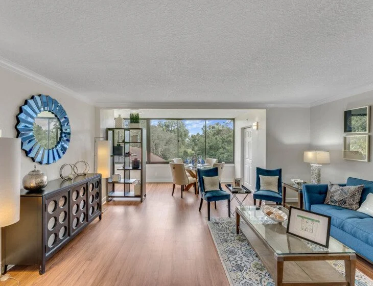 expansive dining and living area of senior villa home featuring wall-to-wall window