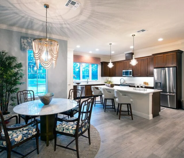 open-concept kitchen and dining area of senior villa at Village on the Green