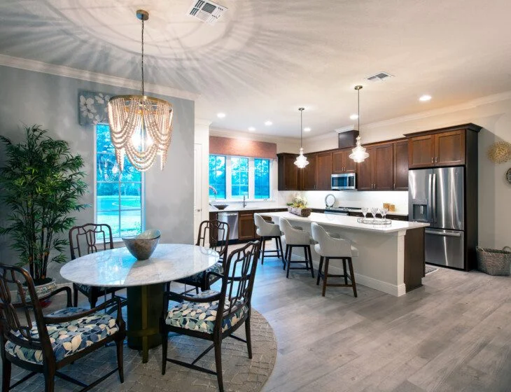 open-concept kitchen and dining area of senior villa at Village on the Green