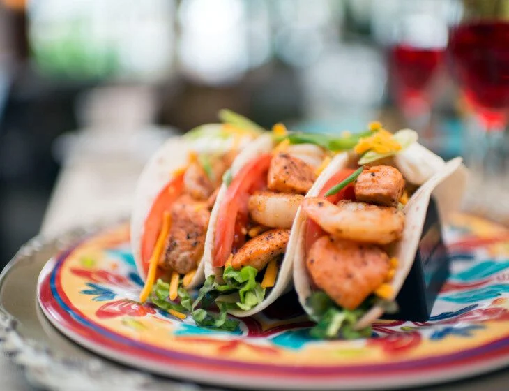 close-up of delectable shrimp and chicken soft-tacos
