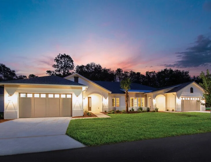 street view of brand new villa homes at Village on the Green Senior Living Community, illuminated at night