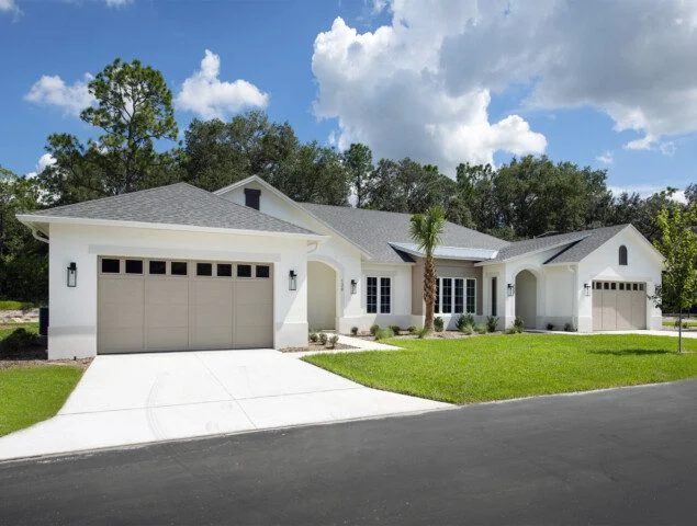 street view of white villa home at Village on the Green Senior Living Community