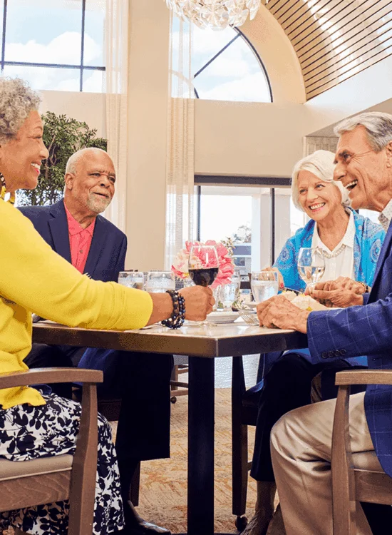 two couples enjoying a meal and conversation