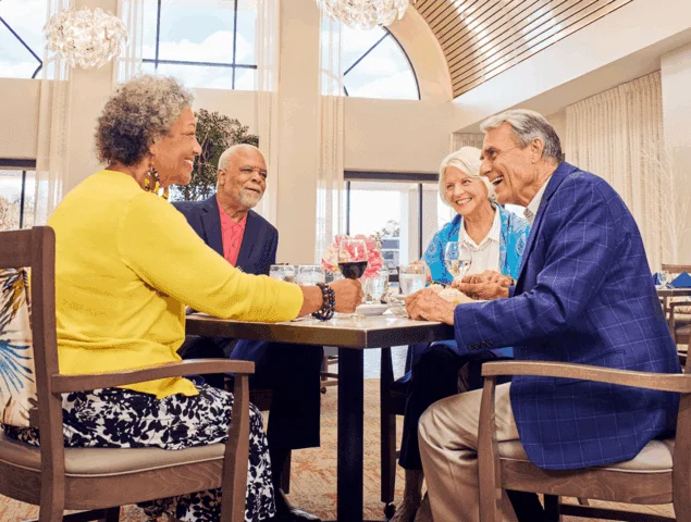 two couples enjoying a meal and conversation