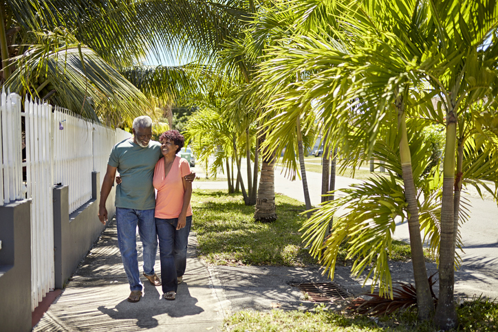 seniors walking together in residential district in Florida