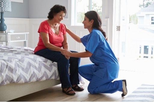 healthcare worker talking with a senior about assisted living