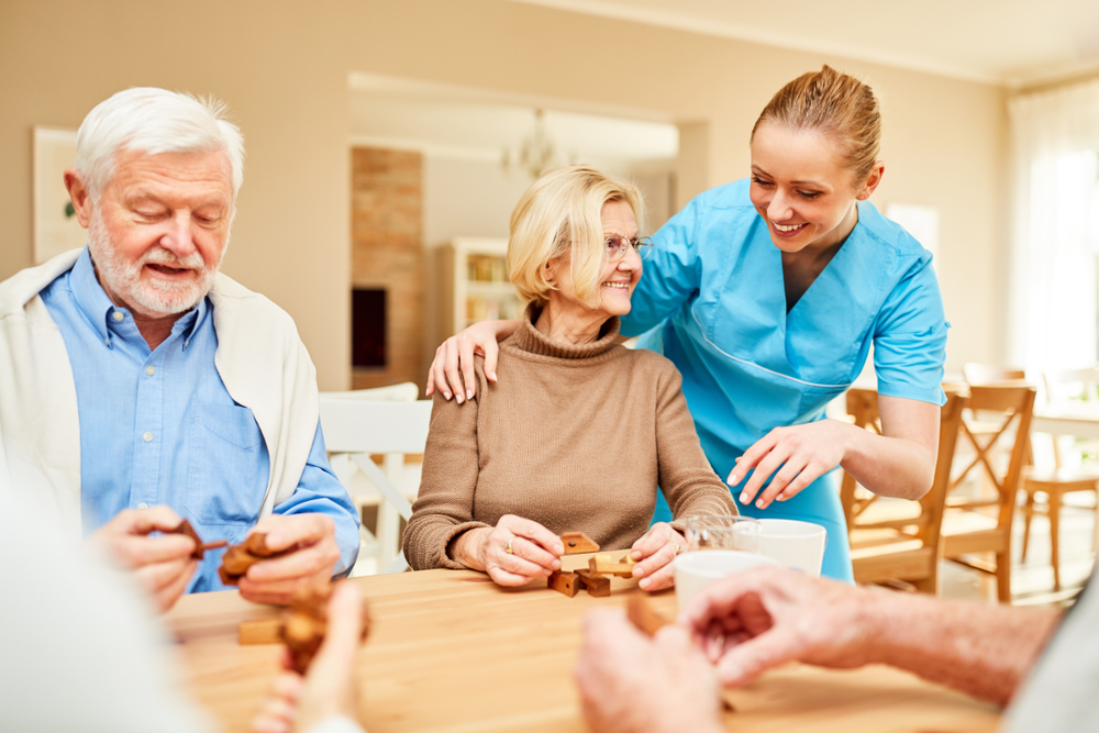 Senior living residents sitting around a table