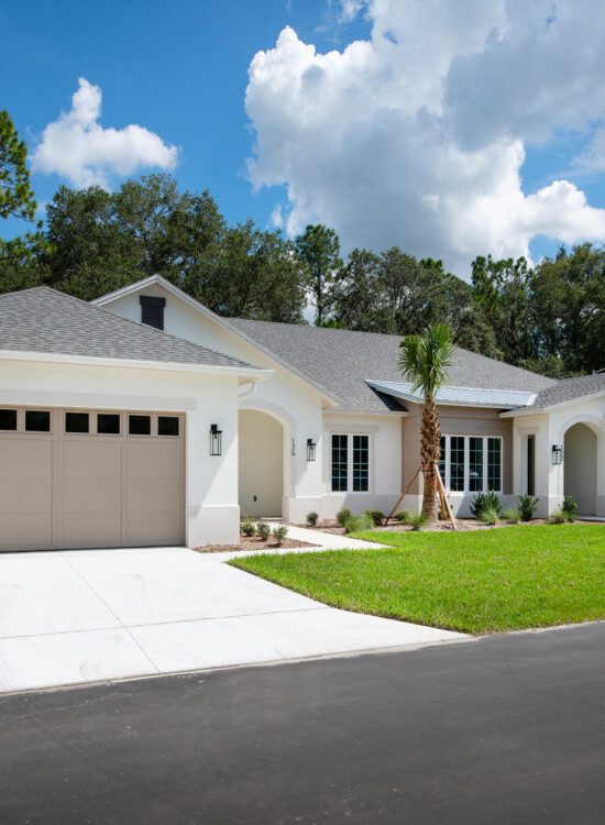 street view of large, new senior villas at Village on the Green Senior Living Community