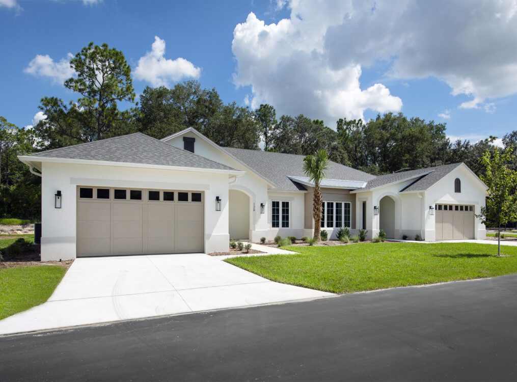 street view of white villa home at Village on the Green Senior Living Community