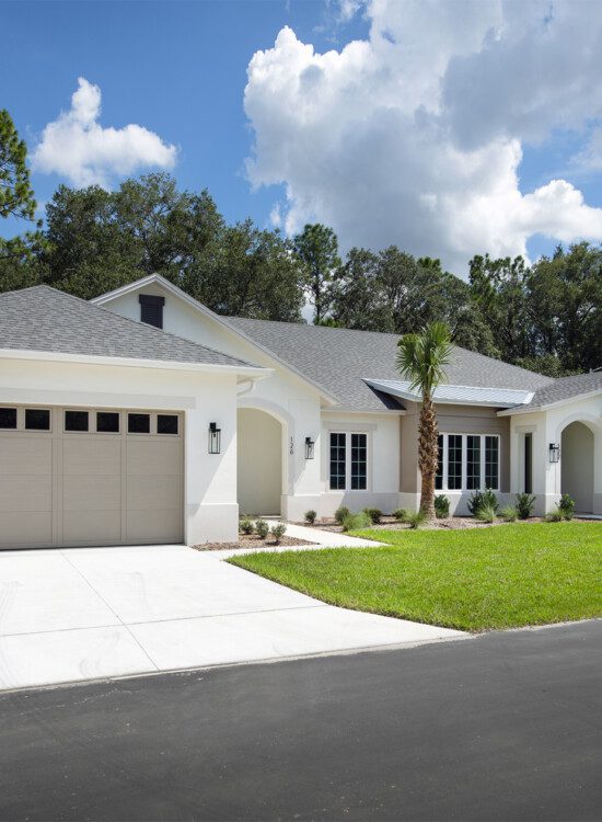 street view of white villa home at Village on the Green Senior Living Community