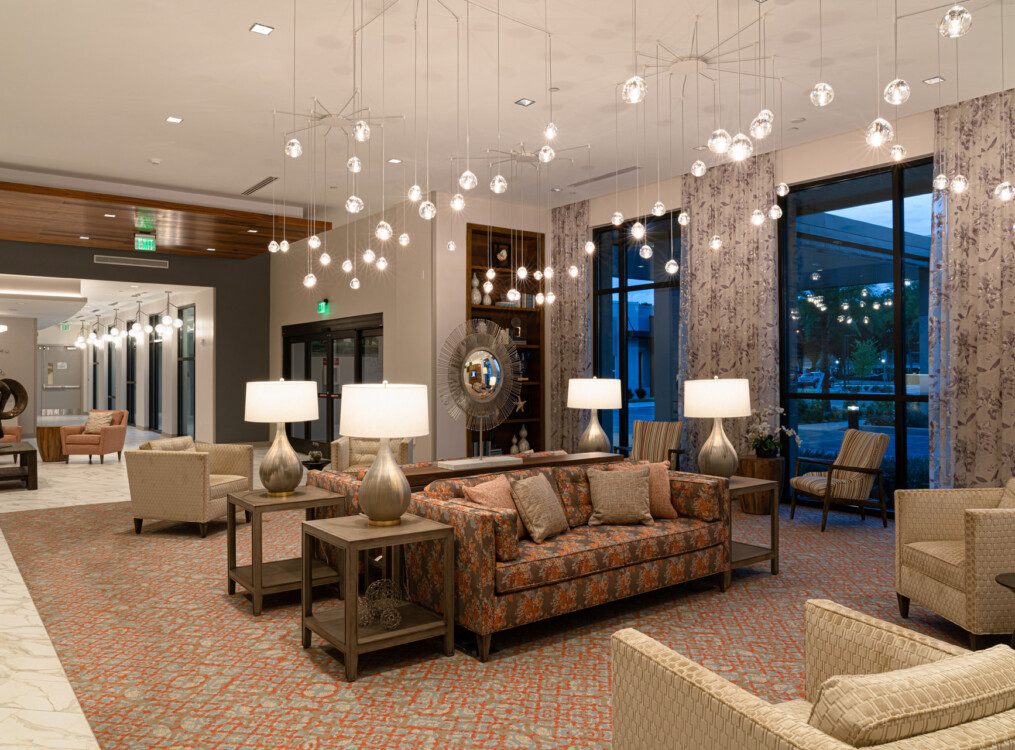 spacious interior lounge area at Village on the Green Senior Living Community