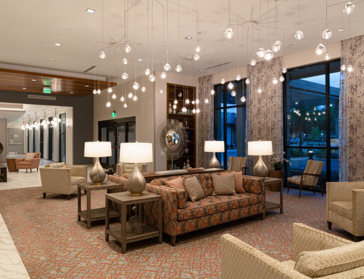 spacious interior lounge area at Village on the Green Senior Living Community