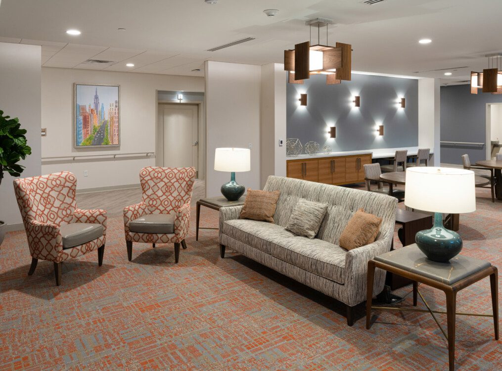 spacious interior lounge area at Village on the Green Senior Living Community